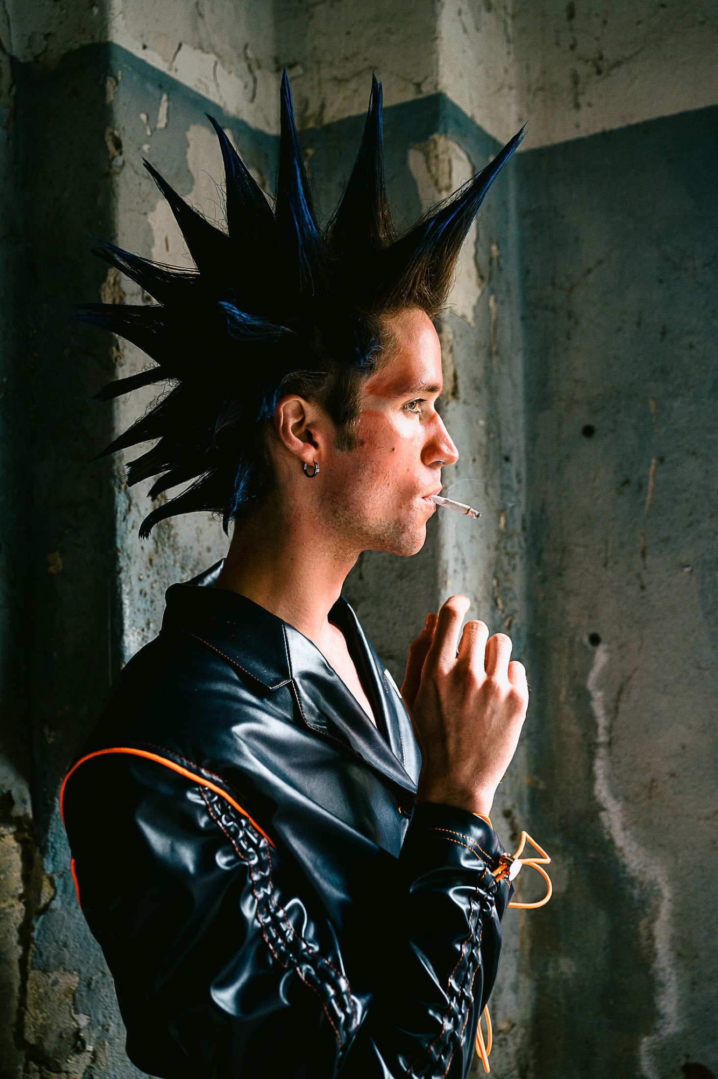 Backstage portrait with spiked hair and black jacket