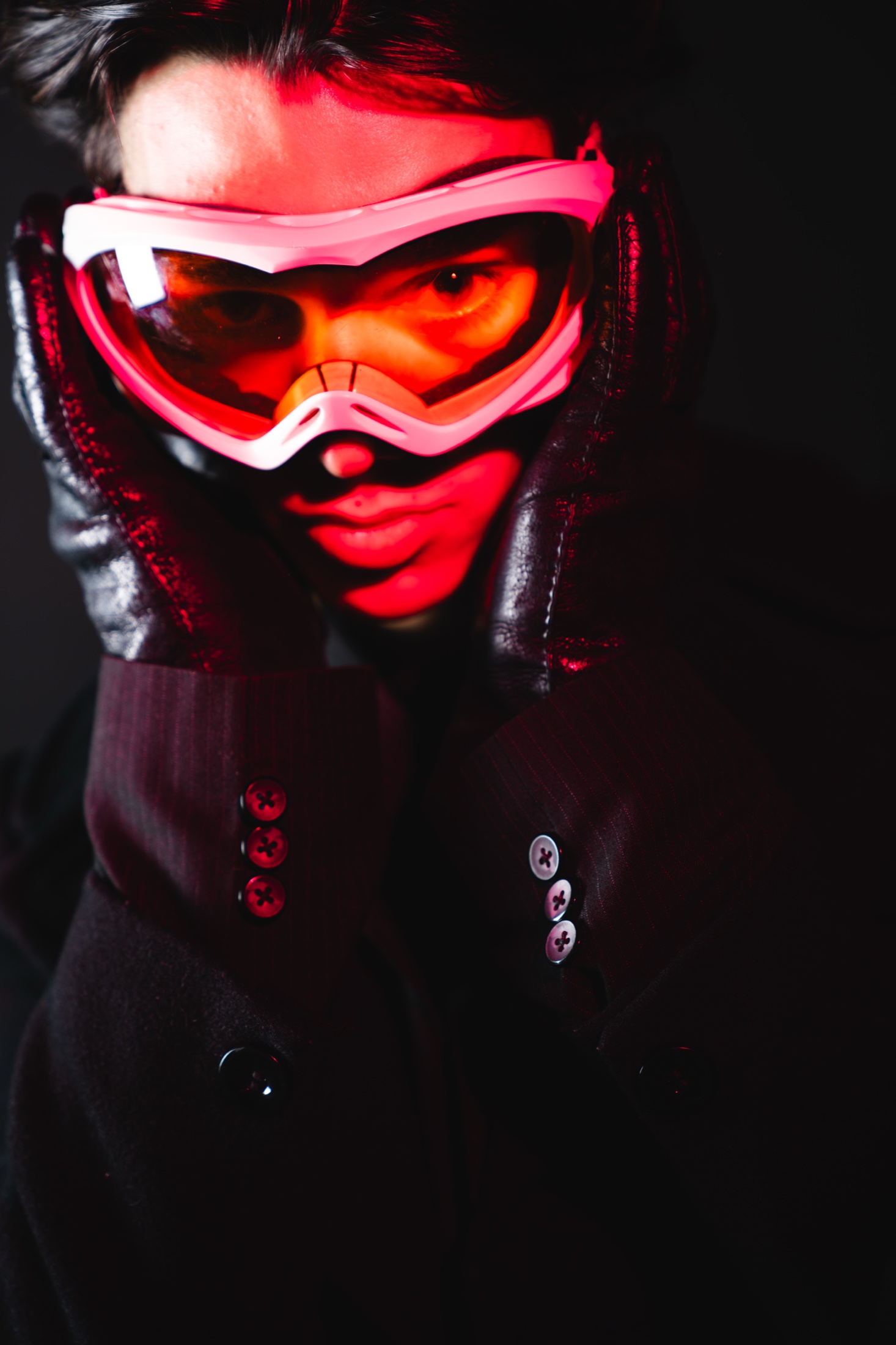 Close portrait with orange goggles and red light