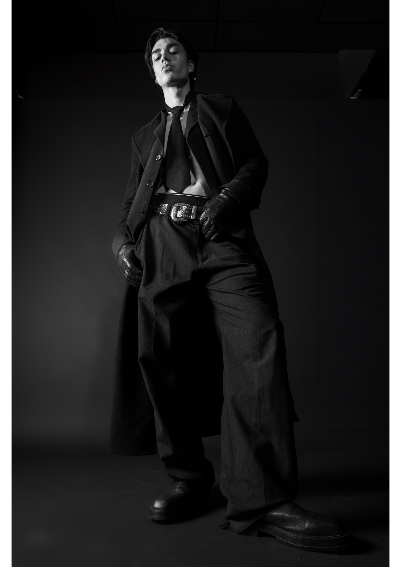 Low angle black and white portrait in layered tailoring